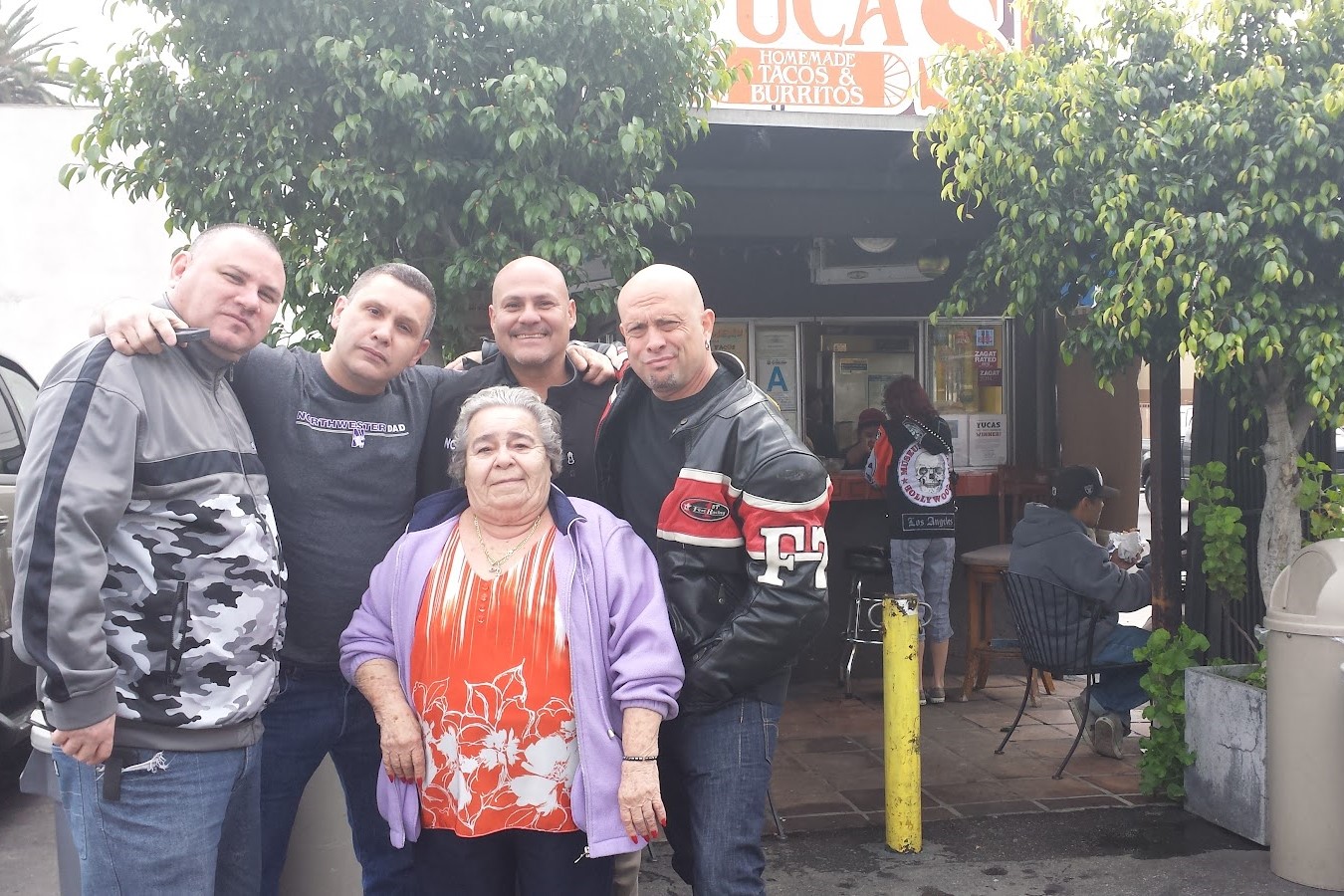 Yuca's Restaurant - Owner with customers